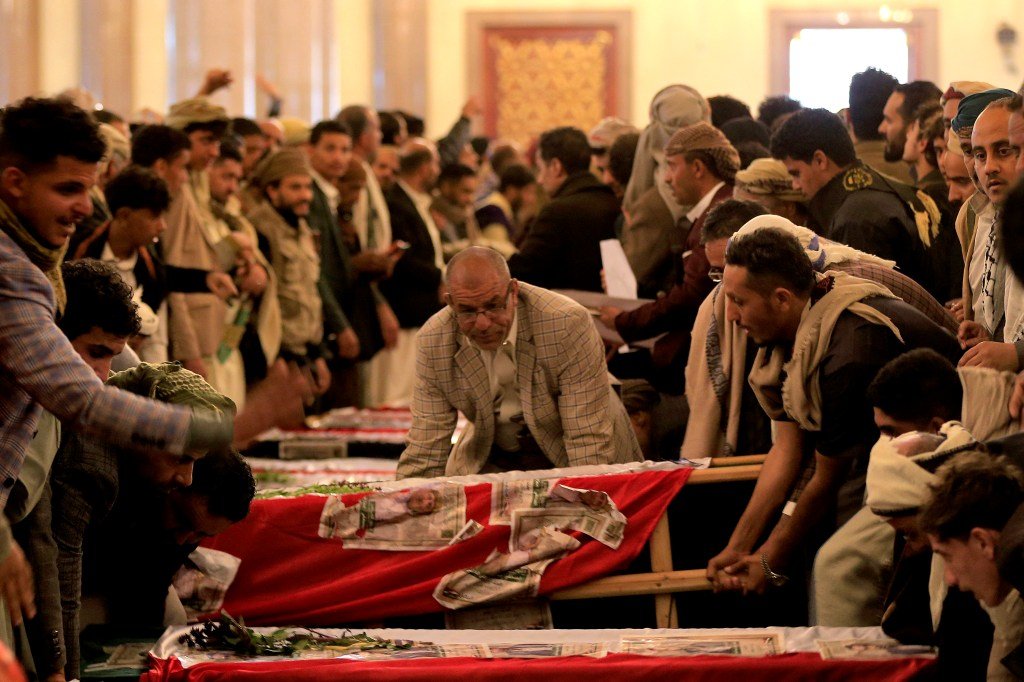 Mourners carry caskets during a funeral for journalists who were killed the previous week in an Israeli airstrikes on Sanaa.