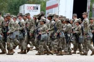 Members of the Texas National Guard assemble in Elwood, Illinois, at the Army Reserve Training Center in the southwest suburb of Chicago.