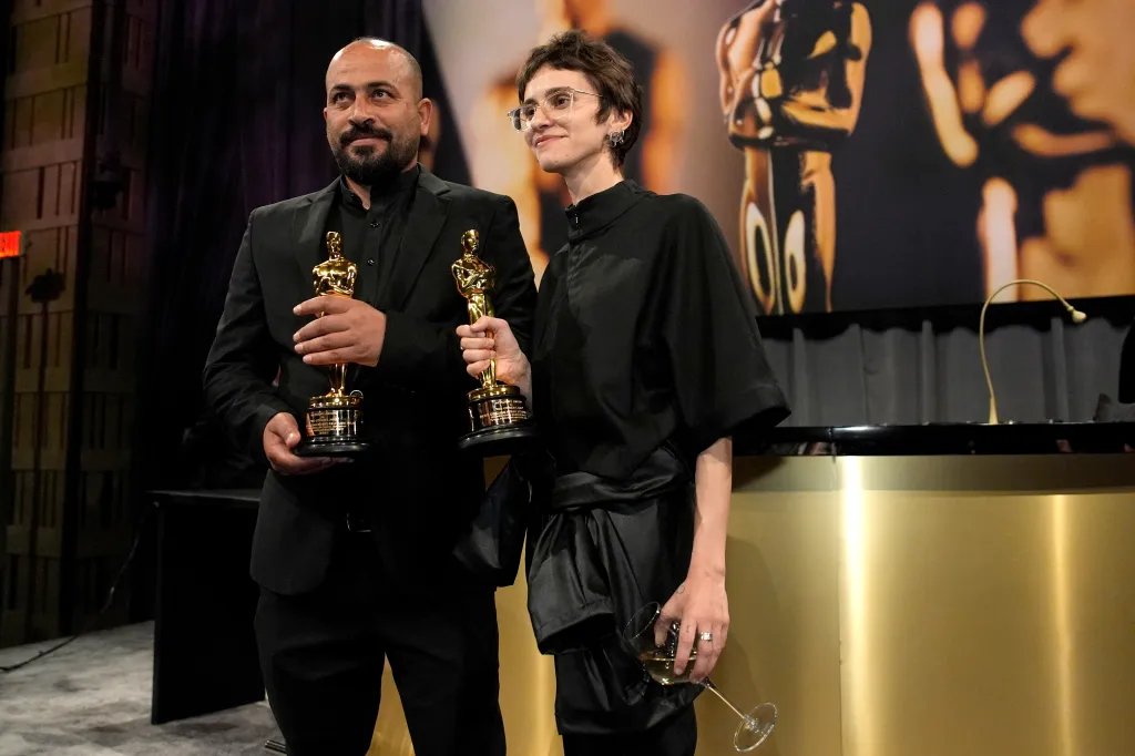 Hamdan Ballal, left, and Rachel Szor, winners of the best documentary feature film award for "No Other Land," attend the Governors Ball after the Oscars on March 2, 2025, in Los Angeles.