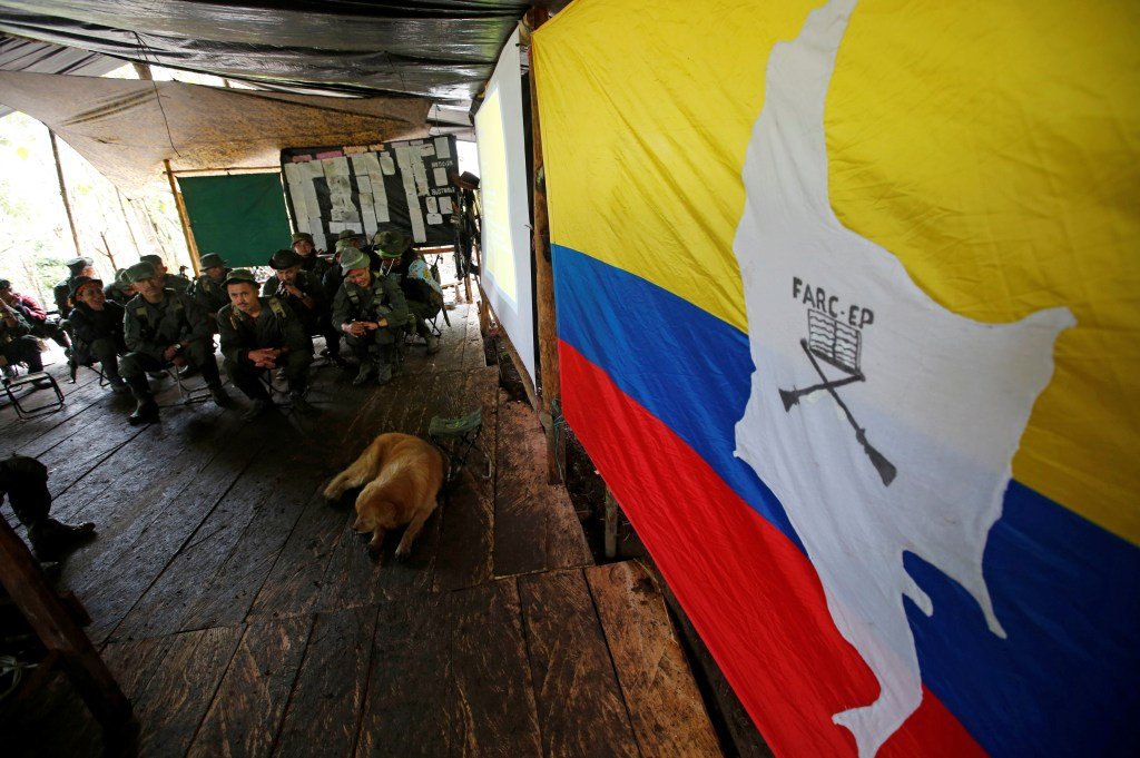 Members of the 51st Front of the Revolutionary Armed Forces of Colombia (FARC) listen to a lecture on the peace process between the Colombian government and their force at a camp in Cordillera Oriental, Colombia, August 16, 2016. Picture taken August 16, 2016. REUTERS/John Vizcaino