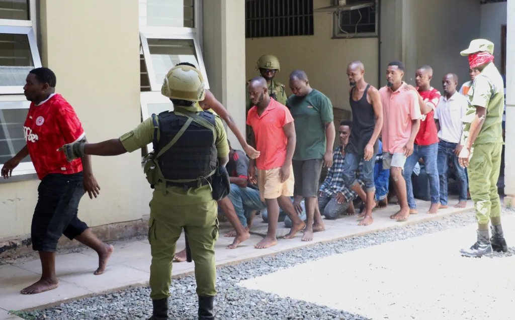 Tanzanians charged with treason for alleged involvement in violent protests arrive at court in Dar es Salaam on November 7, 2025.