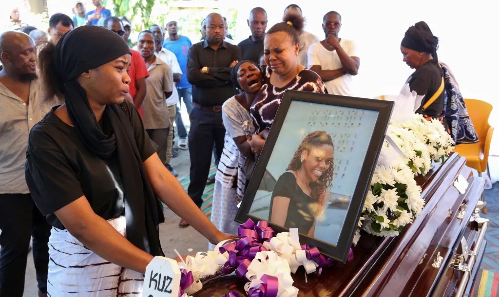 Relatives react near the coffin of Dainess Raphael Sisa, 28, who was shot dead during election-related unrest on October 29, before her burial in Dar es Salaam on November 26.