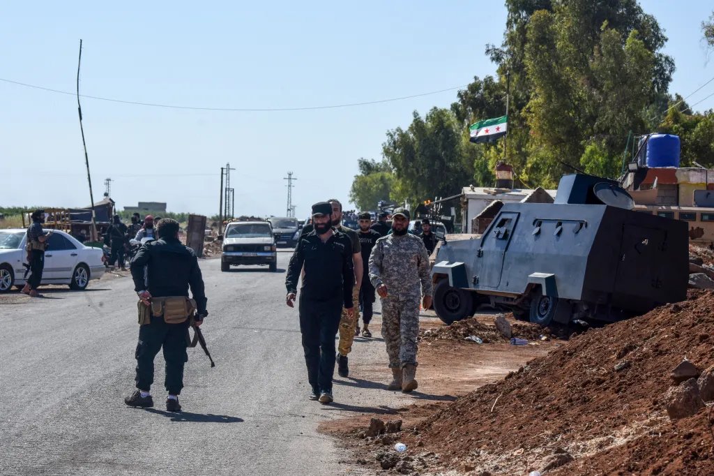 Syrian government security forces man a checkpoint to prevent Bedouin and tribal fighters from reaching Sweida in July.