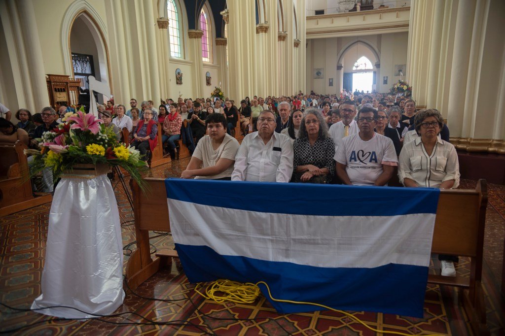 Exiled Nicaraguans attend a Mass in honor of others exiled from the country, in San Jose, Costa Rica, Sunday, April 27, 2025. (AP Photo/Jose Diaz)