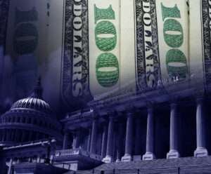 The U.S. Capitol is seen underneath $100 bills