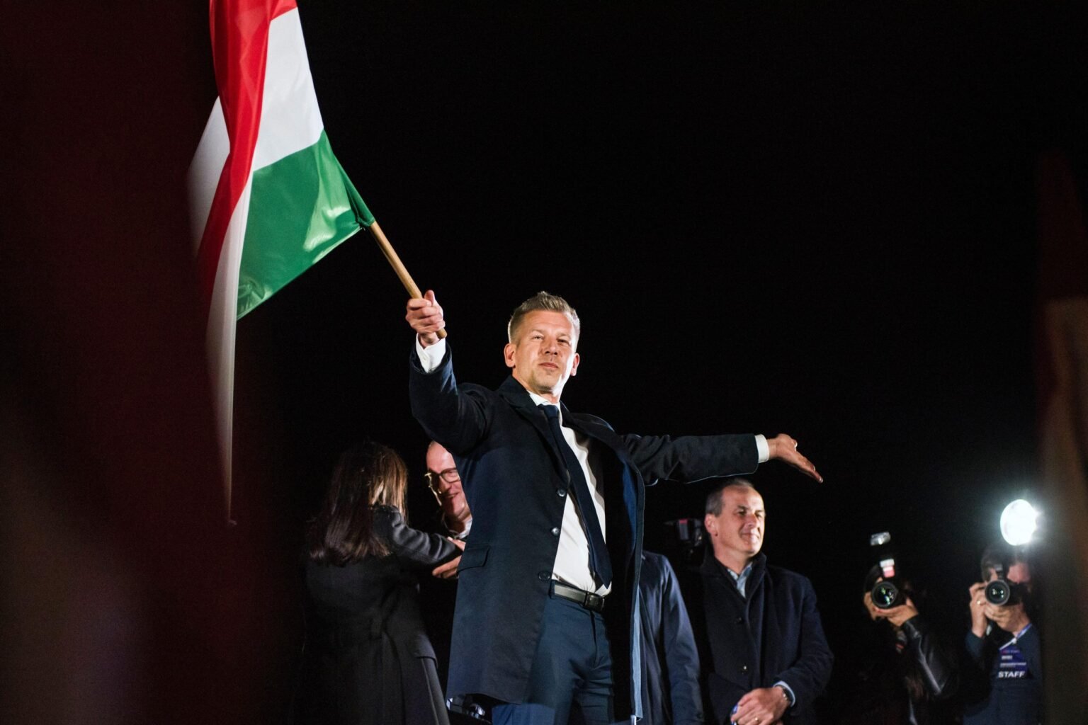Budapest, Hungary. 13th Apr, 2026. Peter Magyar waves the Hungarian flag after his speech during the TISZA party’s election night event in Budapest. Photo: ZUMA Press/Alamy

				
				
				
				
				The Index team has been absorbed in everything Hungary-related this week. No surprise there, given Péter Magyar’s seismic election victory on Sunday, and Index’s roots in eastern Europe. Our latest magazine – just launched – explored the effect Orbán’s had in Hungary and on spreading his brand of illiberal democracy. We’re deep in the conjecture stage, awaiting what happens next and asking what an ex-Fidesz conservative who rode to power on an anti-corruption campaign will mean for freedom of expression. Could be good, could be the same old. We’ll be watching closely.
Already some positive news there though: Magyar has announced that he will suspend the Orbánised state media and only restore it when objective and impartial reporting can be ensured. It’s a similar move to the one Donald Tusk made when he became Prime Minister of Poland. Magyar also announced that he’d be looking into Viktor Orbán’s influence campaigns. Martin Bright reported on this for the latest magazine, attending a conference in Brussels which was funded by the Hungarian government and intended to bring together far right parties from around Europe. The event was part of a much wider project paid for partly by Russian oil money (filtered through Hungary) which smacked of foreign interference in European democracy. There now needs to be an urgent investigation of the funding of UK-based organisations and politicians by the Orbán government.
And when it comes to illiberal forces meddling in overseas affairs, there is way too much of that around. The Guardian rather made the point for me when they broke the story this week of London’s Victoria and Albert Museum censoring its own catalogues to keep in with Beijing. A series of images were removed upon the request of the Chinese printers. One of the images was a historic map of the British Empire, which included China. Presumably its 1930s borders didn’t dovetail with Beijing’s current narrative around Xinjiang and Tibet. This is not the first time the V&A has done an image swap upon the request of Beijing. Nor is the V&A alone, such interference has been happening for a while.
The V&A’s justification came down to cost. Apparently using a Chinese printer is half the price of a British or European one. I don’t doubt that. But while I have no idea of the financial margins we’re talking about here, I do know about the broader consequence: An emboldened China, a country that places bounties on the heads of Hong Kong dissidents and harasses lawyers, protesters, activists and journalists alike over here. This is the real cost of doing business on Beijing’s terms. It’s depressing that our cultural institutions – which are meant to be the leading incubators of plural thought after all – are playing ball.
The cost also isn’t confined to China; such capitulation emboldens others. So yes it’s great that this week we’ve potentially been rescued from the full-scale Orbánisation of Europe, but he was ultimately just a symptom of a rotten global order, one where speech rights can be bought by the highest bidder – or in the case of the V&A the one offering the cheapest paper.

			
			
					
				
				
				
				READ MORE