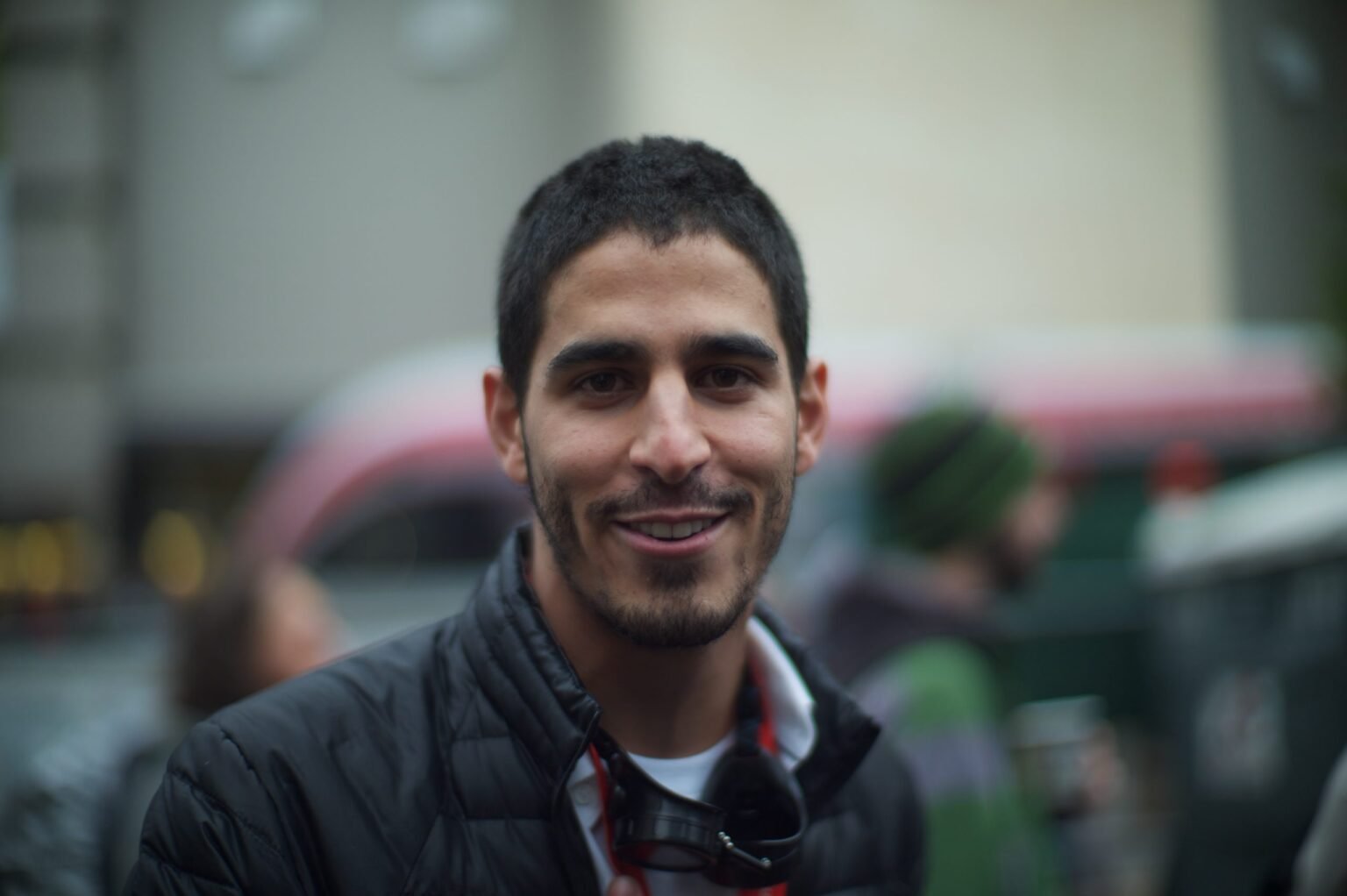 Journalist Ahmed Shihab-Eldin has had his Kuwaiti citizenship revoked. Photo: Mohamed Nanabhay/CC BY 2.0

				
				
				
				
				One early April morning, the newsroom of a Kuwaiti television channel skipped all mention of the sirens that had wailed through the night and disrupted everyone’s sleep. American and Israeli missiles had been raining on Iran for weeks, and Kuwait was one of multiple neighbours Tehran had been lashing out against. But the crew, like many others in the tiny state, had learned that the night’s developments were not free to speak about.
Najwa*, a Kuwaiti journalist with more than two decades of experience and part of that broadcaster’s team, says she has never seen censorship this bad. “The ceiling of freedom is completely shattered,” she tells Index on Censorship by phone, asking to be referred to by a pseudonym for fear of persecution.
She is not alone.
Since US-Israel hostilities on Iran began on 28 February, a sweeping crackdown on war-related speech has consumed the Arabian Gulf. Journalists have been silenced, residents detained, and the basic act of filming the sky – plumes of smoke, the aftermath of a strike – has become a prosecutable offence across multiple Gulf states. The legal architecture enabling these crackdowns predates the war. The conflict has provided governments a pretext to activate it at scale.






The most visible case is that of Ahmed Shihab-Eldin, a prominent dual US-Kuwaiti journalist who was detained in Kuwait on 2 March after posting a geolocated video of a jet crash linked to the conflict. After global calls for his release, Shihab-Eldin has since been acquitted, but stripped of his citizenship, a tactic aggressively deployed by Kuwaiti government in recent year, impacting over 60,000 people, according to estimates. The outcome has been the complete silencing of critics, including those who were previously vocal who fear facing this fate. The practice, justified by the government in Shihab-Eldin’s case as the result his illegal dual nationality, affect not only Shihab-Eldin, but his siblings.






But Shihab-Eldin’s case is part of a much larger story of media clampdown that has received little international attention. “There is no official figure, but it is informally circulated that approximately 1,200 people have been detained by state security –  either for filming strike locations or for expressing sympathy with Iran,” says Najwa.

For Kuwait, the current climate carries a particular weight. The small Gulf state was long regarded as the region’s most democratic: it had the Arabian Gulf’s most combative freely-elected parliament, a constitution that meaningfully constrained the ruling family and a media spectrum that reflected and responded to that political pluralism. For decades, journalists pushed boundaries their counterparts elsewhere in the Gulf could not approach.
That reputation began unravelling in 2024, when the then-new Emir suspended parliament indefinitely alongside key articles of the constitution, removing the most significant institutional check on executive power, and with it much of the legal and political cover that had allowed a relatively open press to function.
It is against that backdrop that the war arrived.
Najwa describes a media environment now operating under unspoken martial law. Official information about the war is channeled exclusively through a daily military briefing, prepared by military and security apparatuses and delivered on screen by a uniformed spokesperson. The briefings offer the numbers of drones and missiles intercepted. They make no mention of strike locations, infrastructure damage, or Iranian strikes on Israel. Kuwait’s media, Najwa says, has been instructed to adopt the American narrative framework wholesale. Any deviation carries grave consequences.
For a country where roughly 30% of its 1.4 million people are Shiite and therefore carry close ties to Iran as the world’s preeminent Shia state, this war is a particular conundrum. On 6 April, a local press cited official Kuwaiti statements warning against content that “incites sectarian discourse” and urging the avoidance of “provocative content online.”
“State security has expanded its net to include the charge of sympathising with Iran,” Najwa says. A “like” on a post, or a comment, can be interpreted as sympathy with the enemy and referred to state security for interrogation.
She gives the specific example of Zainab Dashti, a broadcaster and former freelance presenter at state television, who posted opinions on X that authorities deemed pro-Iranian. According to Najwa, Dashti was detained by state security in early March and has not been released. Two other Ministry of Information broadcasters were informally suspended from work because of their association with her. Old tweets from 2012 and 2014, praising Hezbollah at a time when the organisation was not yet criminalised in Kuwait, were surfaced and used against them.
Index on Censorship could not independently confirm these allegations. But Najwa is unequivocal: “Even insinuation can be reframed as sympathy with Iran.”
The situation is so acute that Najwa deleted her WhatsApp conversation with this reporter the moment it ended. “Even this conversation with you,” she said before hanging up, “after we finish, I will delete it. Because at any moment, if someone searches my phone – at a checkpoint, anywhere –  and sees this conversation, I could be referred to state security. And when people are referred to state security, there is no fixed charge, no fixed timeline. There are people who have been there since the beginning of March and have not yet appeared before a court.”
The pattern is regional. In Saudi Arabia – Iran’s arch-rival and competitor for regional hegemony – an expatriate journalist who has reported from the kingdom for over six years describes conditions as unprecedented. “We are not told which targets were struck, and sources refuse to share details,” they told Index, asking not to be named. “We learned from unofficial sources that workers at petroleum facilities are not allowed to bring in their phones, so as not to capture the scale and scope of damage. People are terrified of taking pictures. Street banners warn against filming anything, disseminating news, or distributing so-called rumours. There are no clear and direct instructions hindering journalists, but the overall environment is crippling.”
The legal framework enabling these crackdowns, says Inès Osman, Executive Director of MENA Rights Group, predates the war but has been radically redeployed. “What has changed is the scope of who is considered a target and what is considered political. Ordinary citizens posting a video of smoke on the horizon did not necessarily see themselves as engaging in an act that could get them prosecuted. Authorities are now treating war-related content as falling within ‘endangering national security’ or ‘harming the reputation of the state’, which carry heavy sentences.”
Osman points to a deeper motivation. “Gulf states have spent millions marketing themselves as stable, modern, investable. Any narrative that runs against that is ultimately threatening their very foundation,” she says, referring to booming economies in Saudi and the UAE, competing over foreign investments, and other smaller ones vying to catch up. The war, she argues, has made explicit a bargain many residents, particularly expatriates, had allowed themselves to forget. “We deliver security and prosperity, but you need to keep silent.”
The numbers are stark. In the UAE, Abu Dhabi police have reportedly arrested hundreds for sharing footage of strikes and interceptions, with at least 35 individuals receiving orders related to “misleading” videos and reports suggesting up to 70 British nationals may face charges. In Qatar, more than 300 people have reportedly been detained for sharing war imagery. In Saudi Arabia, 19 journalists have been detained alongside blanket photography bans, backed by an official campaign warning that sharing such footage “serves the enemy”. A March 10 report by Reporters Without Borders documented intensifying restrictions across the region. The United Nations has raised alarm over civic repression.
Even as a fragile ceasefire takes hold, Osman is not optimistic. “History has shown that emergency measures almost always become permanent. The post-9/11 counter-terrorism framework was kept and significantly expanded, well after the original justification faded. Even if the bans are formally lifted, they will leave behind a climate of fear and self-censorship.”
In Kuwait, Najwa puts it more plainly. The war, she says, may pause. The silence it has enforced may not.

			
			
					
				
				
				
				READ MORE