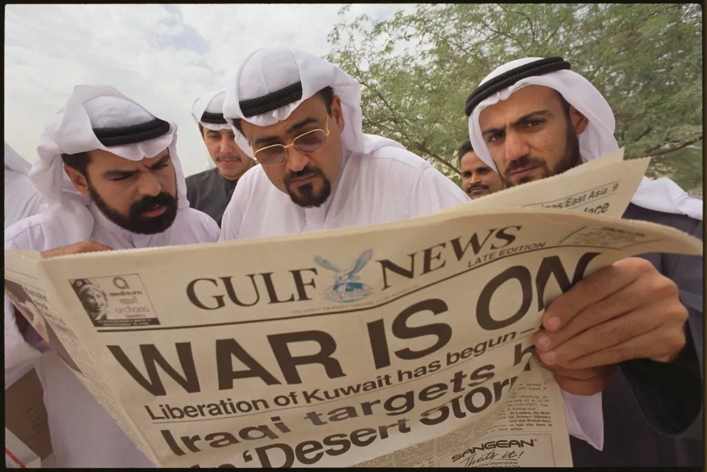 In 1991, Kuwaiti exiles read the latest news on the fate of their Iraqi-occupied homeland in a local English newspaper in Dubai.