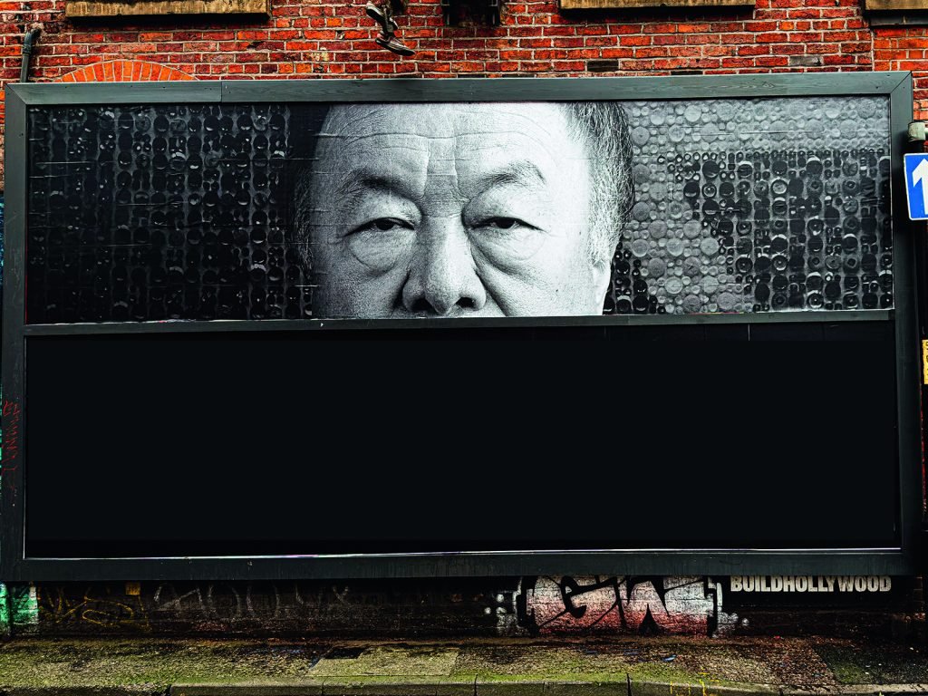 An Ai Weiwei billboard in Manchester, January 2026. Photo: Andrii Shevchuk/Alamy

				
				
				
				
				
			
				
				
				
				
				
				
				
				
				
				
				
				
				
				
				
				
				
				This article first appeared in the Spring 2026 issue of Index on Censorship, The monster unleashed: How Hungary’s illliberal vision is seducing the Western world published on 2 April 2026. 
Ai Weiwei’s new book is, in a sense, anything but new. “Censorship, through intimidation and sanction is evident in the history of the Chinese Communist Party,” he writes in Ai Weiwei on Censorship, recently published in the United Kingdom by Thames and Hudson. This frame of reference does more than anthologise, however. History puts the present in context. “For over 70 years, censorship policies have been a core function of the regime and a widely accepted aspect of society. The first to be sanctioned were always those with independent thought or differing political ideologies.”
Index spoke with Ai via email. He was in a Cambridge cafe during his UK book tour in February 2026. The university town is not unfamiliar for Ai; his teenage son goes to school in the city. But over the last decade, Ai has lived a peripatetic existence. He keeps a studio in Berlin but no longer lives there. Cambridge was home for a while. In 2020, at the beginning of the pandemic, Ai moved to Portugal. But he does not call that country, or any other, home. “I do not have a country, nor a homeland, but I don’t need one,” Ai told Index. “I just need to wake up every day and recognise that I am still alive.”
Last August, Ai briefly travelled to Kharkiv, a frontline of the four-year war started by Russia’s invasion of Ukraine. “It was a surreal experience to witness Ukrainians defending their own territory and their national dignity,” he said. “Their commitment is immense.”
In mid-December, Ai visited China for the first time since leaving in 2015. “Meeting up with my ninety-three-year-old mother was a special experience,” he said. “I feel [that] in certain respects China has not changed at all. But it also felt unfamiliar – a sensation I had never experienced before.”
Ai posted a limited number of pictures and videos of the trip – without commentary – on Instagram in real time, though they could not be viewed in China itself. Ai is critical of social media platforms in general. They “engage in active and passive censorship under governmental influence,” he said. Nevertheless, he does use Instagram, “as a diary, to deposit traces of my everyday life,” he explains.
All that said, Ai is concerned about the ubiquitous presence of social media in everyday life. It is gradually turning us passive and docile, he thinks. “Today, trying to maintain independent thought is far more difficult than it was in the past,” he told Index. “Controlled by major powers, large capital, huge corporations, and dominant technology, the internet is serving to extract even greater resources, exploit humanity’s information, guide consumption, and even mislead public opinion to manipulate the populace.”
Artificial intelligence has, over the last few years, become the dominant presence in the global conversation about the reach – and overreach – of technology and commerce into the private lives of citizens. Ai equally distrusts AI. In his opinion, it is already boxing us into a more homogenised global society. He referenced an incident (without specifying the precise details) where someone testing China’s Deepseek AI platform asked it to talk about Ai Weiwei. Deepseek’s response? “Let’s talk about something else.”
“[AI] is commonly described as a liberating productive force, but … systems impose new constraints on traditional ways of human existence, producing a reality that is more unpredictable, chaotic, and disruptive,” Ai said. “Eventually, we are going to lose the poetic aspect of human nature, which includes each individual’s possibility [sic] of making mistakes according to their own habits.”
The symbiotic relationship between big data and censorship is a key theme in Ai’s book. In the country where he grew up, he notes, this relationship has created an inescapable panopticon. “[In] China, censorship operates around the clock, infiltrating every channel of communication. It impacts all forms of personal expression related to the public, whether communicated through publications, art exhibitions or social networks.”
Ai Weiwei’s Study of Perspective is a universal gesture of defiance to the world. Photo: Ercilla/Alam
Running in the family
Ai Weiwei comes from a family of dissenters. His father, Ai Qing, was one of modern China’s most influential poets. A key text of his is Understanding Writers and Respecting Writers, published in 1942.
“Writers ask for no privileges other than the freedom to write,” Ai Qing wrote in the essay. “Only when artistic creation is granted … can art play a role in advancing social reform.”
In the early days of the communist revolution, Mao Zedong sought Ai Qing’s advice about the potential role that culture could play in a communist society. But their views were not compatible. Despite being a voracious reader and lover of poetry, Mao did not believe that writers should be treated with respect or understanding.
Ai Weiwei was born in Beijing in 1957 – the same year that Mao launched the so-called Anti-Rightist Campaign. 300,000 individuals, including many artists and intellectuals, were exiled to China’s remote border regions, to undergo reform and political education. Ai Qing was banished to Heilongjiang Province, in the far northeast.
A decade later, at the onset of the Cultural Revolution, Ai Qing was moved to the desert region of Little Siberia. Daily duties included cleaning toilets. Ai joined his father in political exile. “That experience with my father helped me recognise the worst aspect of human nature: blindness and ignorance,” Ai told Index.
From his father, Ai learned that the artist’s life – despite the difficulties that this would, of necessity, entail – could help in forging a path towards political resistance. In 1981, Ai left China to study in the USA, at the Parsons School of Design in New York. His artistic mentors from that period included the Irish-American artist Sean Scully and Allen Ginsberg, the acclaimed poet. In 1988, Ai put on his first solo art show, Old Shoes, Safe Sex, at New York’s Ethan Cohen Gallery. Five years later, Ai returned to China to be with his father, who had fallen ill. Ai Qing died in 1996, aged 86.
The biographies of father and son have many commonalities. Both received their artistic education in the West (Ai Qing, between 1929 and 1932, in Paris); both were publicly persecuted and silenced for refusing to conform with the China Communist Party’s codes of political censorship. Ai’s difficult relationship with the Chinese authorities began in 2005 when he started a blog in China. “To express yourself needs a reason, but expressing yourself is the reason,” his first post read.
“This is my question: where are those lives?” another blog post, from the summer of 2008, asked. Ai was referring to the estimated 80,000 individuals killed in an earthquake in the southwestern Chinese province of Sichuan. In the wake of the natural disaster, the Chinese government censored and controlled information, so Ai decided to undertake a “citizens’ investigation”. Accompanied by followers from his blog, he travelled to the ruins of the earthquake and began to document the names of those who perished.
“I met many families who lost their children,” said Ai. “I was trying to raise a collective voice in pursuit of fairness and justice, but it felt almost impossible.”
The following summer, as the 20th anniversary of the Tiananmen protests approached, Sina – China’s biggest news portal – shut down Ai’s blog because he refused to self-censor his posts. Ai, remarkably, seems almost blasé when recalling this period of censorship: “In one moment we believe that a certain space for freedom exists, but in another moment that space disappears. This is part of the normal order.”
Under surveillance
In early April 2011, the Chinese authorities detained Ai at Beijing International Airport, as he was about to board a flight for Hong Kong. His interrogators put absurd allegations to him about his conduct, claiming that he was engaged in “economic crimes”, but keeping the details vague.
The politically motivated accusations, Ai told Index, were meant to break my “commitment to truth justice” and “to tarnish my reputation”. He said: “I was secretly detained for 81 days, but I was not subjected to verbal, physical harm or humiliation. The harm I endured was more of a psychological nature.”
The episode gave Ai a valuable insight into how power works within a complex state bureaucracy. “It was not about right or wrong; but [about] the singularity and certainty of power’s inviolability”, he said. “Which makes all the efforts you have made appear pale and powerless in its presence.”
Despite his release without charge, Ai’s passport was confiscated by the state. Then in the autumn of 2015, he discovered a hidden listening device inside his Beijing art studio. The authorities had “assumed I was engaged in secret and disreputable activities,” he said. “I believed they would come to recognise their misjudgement since my actions were entirely open and public.”
Farcically, the authorities asked Ai to return the surveillance device – which he described as resembling an outdated relic “from the Cold War era”. By then, his passport had been returned. He was free to travel. Ai left Beijing for Berlin. The following February, as the refugee crisis sparked by unrest in the Middle East gripped Europe, Ai and a team of artists created a public art installation in Berlin, placing 14,000 unused life vests around the pillars of the Konzerthaus, a landmark concert hall in the German capital.
Not just China
But censorship exists in the West too. In 2023, Ai’s exhibition at London’s Lisson Gallery was cancelled after Ai posted and then deleted social media posts about the Hamas Israel conflict. Ai was keen to point out that recently, he was asked by Britain’s Royal Academy Magazine to write an opinion piece about artists’ ability (or lack thereof) to speak truth to power. “I submitted the article, and then I was informed that due to a reduction in the magazine’s pages, they could not publish my piece,” Ai explained. “Similar things have happened many times in the UK, where they use gentlemanly British politeness to make the most ruthless decisions.” [see box below]. The Royal Academy Magazine was asked for comment,
Ai mentioned other examples of western censorship. “The global film market is now dominated by China,” he said. “There is a desire not to offend major financial backers, so most of my films are rejected by many major international film festivals.”
Ai’s documentary films include Coronation (2020), which secretly filmed hospitals, homes, and quarantine sites in Wuhan, China – the first city to be hit by the global COVID-19 pandemic – and Human Flow (2017), which provided a detailed and emotional exploration of the global refugee crisis. “Everything is Art. Everything is Politics,” reads a caption in the latter film’s opening sequence. Thirty minutes later, another caption appears on the screen. “When the Berlin Wall fell in 1989, there were 11 countries around the world with border fences and walls,” it reads. “By 2016, 70 countries had built border fences and walls.”
But can artists transcend borders and governments? Ai believes yes. Presently, his art is being showcased in exhibitions in New Delhi, Cambridge and Cologne. Later in the year, Ai will be staging exhibitions in Seattle, Guimarães in Portugal, and Gyeongju in South Korea, aside from a Manchester show in July 2026 called Button up! which reflects on two centuries of Chinese British relations, globalisation and interconnected power structures which cause wars and global crises. At 68, the outspoken and resilient Chinese artist shows no signs of slowing down.
Undoubtedly, being a man without a country must take its toll. But there are some advantages too. “I can imagine going anywhere,” Ai said. “The earth is round, and at any latitude or longitude there is the possibility of survival.” Is this the definition of true freedom, the freedom that Ai Qing wrote about back in the 1940s? Not exactly.
“Humanity’s longing for freedom, and the price it pays in pursuit of freedom, is an enduring endeavour,” Ai concluded. “But freedom is an unattainable goal.”
Ai Weiwei’s book On Censorship was published by Thames and Hudson in January 2026
 
			
				
				
				
				
				Truth is at the heart of all art
by Ai Weiwei
For an artist, speaking the truth is not optional; it is the essential quality of art itself. The very existence of art arises from an individual’s particular experience, something that cannot be replaced. Using that experience to express oneself, whether through words or images, is one of the most fundamental ways in which art exists. It is a responsibility, and it is also an obligation. For if art loses its perseverance in truth, its effort to speak true words, then it becomes like a river without water, or a field or mountain without trees – art would lose its very possibility of existing in the world.
Yet in most circumstances, this is not what we see. We encounter many kinds of expression, many forms and languages, but how distant are these forms and languages from art’s essential appeal? We can say that what we usually see is the reiteration of already accepted values, without any expression that offers new possibilities, new sensibilities, or wholly individual feelings. Every artist, like every individual, knows that speaking the truth and insisting on one’s own perspective is dangerous, and may exact a heavy price. Books may go unpublished, exhibitions may be closed, concerts cancelled. We see this every day. Those who refuse to betray their conscience and insist on telling the truth are always the first to be punished. My father, as a poet, endured such punishment throughout his life. He was not an activist nor someone engaged in politics, but rather a poet in the purest sense – someone who would not, in any circumstances, betray his conscience, a man who would speak his mind without calculating gain or loss. He paid dearly for this. He was exiled for 20 years. The year I was born was the year he was exiled. I, too, became collateral, enduring the catastrophic consequences of his truth-telling.
When I was growing up, I did not feel the need to speak the truth because I did not yet know what truth was. But when I reached a certain age, I began to recognise what was false. I detest falsehood to the extreme, because it alters the quality of our lives. It makes us look at our surroundings without confidence. Meanwhile, once we recognise untruth, we no longer dare to look at ourselves. Even so, speaking the truth remains difficult. First of all, language as a form of expression – or art as a form of expression – requires being seen or heard, which is a difficult process in itself. My voice was not heard or seen until I was nearly 50 years old; only then did I find my language and my manner of expression. But this language and manner of expression are not permanent. They are like a plant, and do not have an eternal lifespan. Therefore, as artists, we must continuously challenge and doubt ourselves in our understanding of truth, seeking ways to break through censorship – including self-censorship. In this process of pursuing truth, the path is strewn with thorns and full of obstacles; there is a real risk of falling into the abyss at any moment. Even so, I have paid every price required, and I am proud of that, because I am not doing it for myself but for the world we see with our own eyes, so that it may become clearer, and so that we may express ourselves with greater accuracy. An artist’s being truly exists when there is both self-awareness of the real and self-expression of the real. This “self” does not inherently exist on its own; rather, it emerges when confronted with a certain reality.
Ai Weiwei is a Chinese artist whose exhibitions are held all over the world. This article was originally written for the Royal Academy magazine, but did not appear
			
			
				
				
				
				
			
				
				
					
	
	
			
			
					
				
				
				
				READ MORE