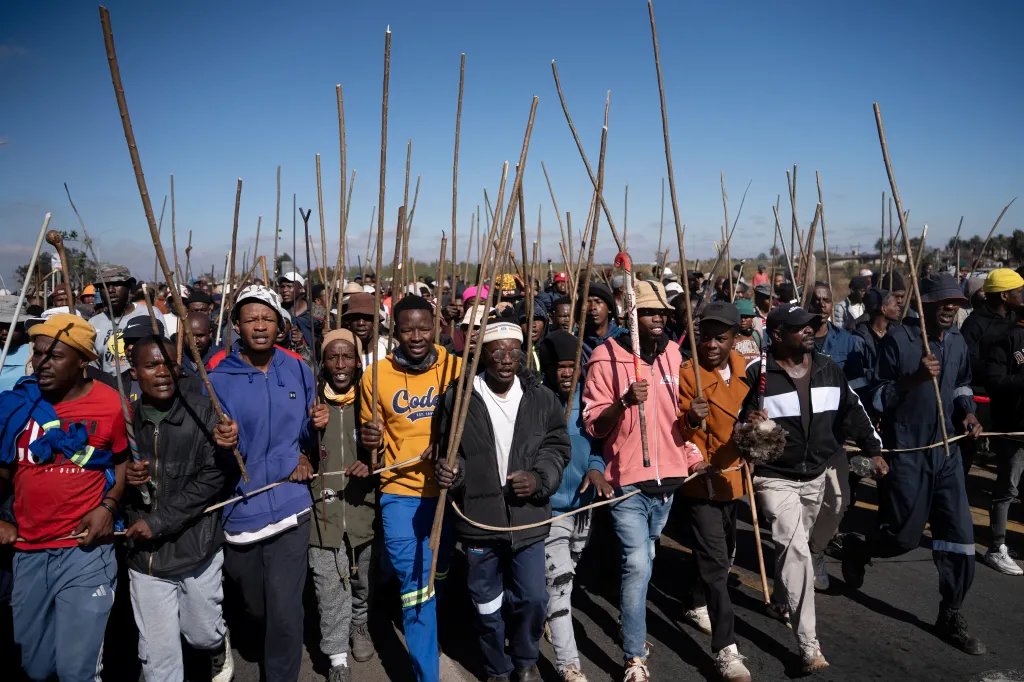 Demonstrators carry sticks during a protest calling for the deportation of undocumented immigrants, as violence against migrants from other African countries increases, in Benoni, east of Johannesburg, South Africa, June 5.
