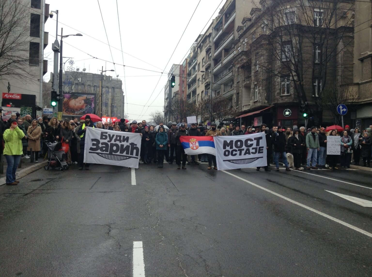 Members of the activist initiative Most ostaje (The bridge stays) block traffic in front of the Radio Television of Serbia building in  2025 paying respect to the 15 victims of Novi Sad railway station canopy collapse Photo: Emilija Knezevic

				
				
				
				
				Download the full report here or read it at the bottom of this article
The partners of the Media Freedom Rapid Response (MFRR) and the Council of Europe’s Safety of Journalists Platform today present a report which outlines the deteriorating situation for media freedom and safety of journalists in Serbia. The report is a result of an international mission to Belgrade that took place in March 2026.
In 2025, Serbia recorded 209 press freedom violations – more than double the 84 documented in 2024 – affecting 359 media workers and entities. As of 16 June, 100 cases affecting 170 media workers have been recorded since January 2026.
Since the deadly collapse of the Novi Sad railway station canopy in November 2024, which triggered the largest protests in Serbia’s history, attacks on journalists covering demonstrations have surged. Law enforcement has not only failed to protect journalists, but police officers have increasingly acted as perpetrators themselves, with at least 38 documented police attacks on journalists since 2025.
The crisis extends well beyond physical safety. Strategic lawsuits against public participation (SLAPPs) continue to threaten public-interest reporting, with Serbia ranking third in Europe for the number of SLAPP cases, according to the CASE Coalition data for 2025. The continued criminalisation of insult compounds the chilling effect on journalists’ work. 
In addition, media pluralism is under severe pressure. The majority state-owned Telekom Srbija has expanded its media holdings, consolidating pro-government narratives across the media landscape. Serbia’s media regulator, the REM Council, has been non-functional for over 18 months, making Serbia the only EU candidate country without a functioning media regulatory body. Coordinated bot attacks and spyware, including NSO Group’s Pegasus, have emerged as tools of digital censorship against journalists and media outlets.
The government has launched several legislative initiatives, including efforts to incorporate provisions of the European Media Freedom Act (EMFA) into domestic law. However, journalists and civil society actors have largely stopped engaging  with these processes, citing a lack of transparency, rushed timelines, and most prominently a profound absence of trust in the government’s intentions. The international community has a critical role to play to safeguard swiftly deteriorating press freedoms in Serbia and stem the wider democratic decline.
The partners of the MFRR and the Council of Europe’s Safety of Journalists Platform call on the Serbian authorities to: 
Immediately cease inflammatory rhetoric targeting journalists and refrain from all verbal, physical, and legal attacks against the press, including the use of SLAPPs. The authorities should also introduce specialised training programmes for police and judicial actors to ensure the consistent application of protective measures for journalists.
The partners further call on the European Union to publicly and unequivocally condemn attacks on journalists in Serbia, and to make direct funding to Serbia in strategic areas conditional on measurable improvements in journalist safety and media freedom standards.
The full report includes detailed recommendations to Serbian authorities, including the government, parliament, police, and prosecution, on the concrete steps needed to counter this crisis.
The mission was coordinated by ARTICLE 19 Europe and joined by the following international organisations: Association of European Journalists (AEJ); European Broadcasting Union (EBU); European Centre for Press and Media Freedom (ECPMF); European Federation of Journalists (EFJ); International Press Institute (IPI); Reporters Without Borders (RSF); Osservatorio Balcani e Caucaso Transeuropa (OBCT); Index on Censorship; and Committee to Protect Journalists (CPJ). The local partner was the Independent Journalists’ Association of Serbia (NUNS). The delegation met with journalists, editors, media associations, civil society organisations, law enforcement, the Parliamentary Speaker, and the Chief Prosecutor, among others. 
 
window.option_df_140073 = {“outline”:[],”autoEnableOutline”:”false”,”autoEnableThumbnail”:”false”,”overwritePDFOutline”:”false”,”direction”:”1″,”pageSize”:”0″,”source”:”https:\/\/www.indexoncensorship.org\/wp-content\/uploads\/2026\/07\/Serbia-Report_Final_Single.pdf”,”wpOptions”:”true”}; if(window.DFLIP && window.DFLIP.parseBooks){window.DFLIP.parseBooks();}

			
			
					
				
				
				
				READ MORE
