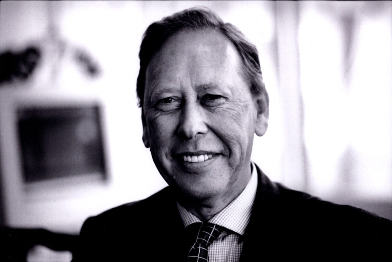 Entrepreneur Dr David Potter was a long-term supporter of Index through the charitable foundation he set up with his wife
Dr David Potter CBE, who died on 28 June aged 82, was a scientist, technologist, entrepreneur and philanthropist. He founded the pioneering technology company Psion in 1980, riding on the wave of the home computer boom and launched the world’s first mass-market handheld computer, the Psion Organiser. The company later went on to become one of the prime movers in the mobile phone revolution, designing the operating system Symbian.
David Potter was born and spent his early years in East London, South Africa before moving to England to attend Trinity College, Cambridge to read natural sciences. He later received his doctorate in mathematical physics at Imperial College, pursuing an academic career in the 1970s with spells at UCLA in California.
Potter met fellow South African Elaine Goldberg while she was working towards a doctorate at Nuffield College Oxford on the political role of the press in South Africa, published as her first book.
The couple met at a party in Tunbridge Wells and arranged to meet up the following weekend in Oxford. “He pretty much proposed to me within a week,” Elaine told me later.
Elaine later went on to work as a journalist at the Sunday Times under legendary editor Harry Evans. While there she co-authored several Sunday Times books, including Suffer the Children: the Story of Thalidomide and Destination Disaster: From the Tri-Motor to the DC10. She later served as a trustee of Index on Censorship for many years.
In 1980 David Potter founded Psion, using money he had made from a scheme investing in the manufacture of duvets, tapping into the British appetite for a more continental lifestyle during the package holiday boom. David located a duvet factory in the north of England and interviewed workers in the local pubs to find out everything about the company before investing in the firm.
Psion was one of the early leaders in developing software for the fast-growing home computer industry, particularly Sir Clive Sinclair’s ZX Spectrum, writing the popular software package Flight Simulation and marketing and distributing the Hungry Horace series of arcade game clones.
From 1984 Psion pioneered the management of personal information by inventing the Organiser, the world’s first mass-produced handheld computers for personal use. His handheld computers, particularly the Psion Series 3, were synonymous with the early 1990s and went on to sell in their millions.
In 1998, David led the creation of the Symbian operating system partnership with mobile phone manufacturers Nokia, Ericsson, Motorola and Matsushita.
One of Elaine’s sisters, the New York art historian and critic RoseLee Goldberg, said on many occasions that “David always described the future”. Elaine said, “He wasn’t a crystal ball gazer, he just had a very good sense of what might be coming down the road.”
He was someone who could make things happen too.
His half-brother from his mother’s second marriage, Colly Myers, once said, “The most useful thing about David is he always believed something was possible. If David said it could be done, it would be.”
David was awarded the CBE, in 1997, for services to the manufacturing industry and in 2001 he was elected a Fellow of the Royal Academy of Engineers. Between 2003 and 2009, David served as a non-Executive Director to the Bank of England.
In my many discussions with him over a period of years, he regularly lambasted the ability of successive British governments to support innovation.
But entrepreneurship was not his only passion.
In 1999, when Psion’s stock was riding high before the dotcom bubble burst, he sold a chunk and established with Elaine an eponymous foundation to encourage a stronger and fairer society. In the 27 years since, the foundation has granted more than £23 million to registered charities in the UK and abroad. The focus of the foundation is on education and civil society and it provided grants contributing to “economic development and well-being in a plural, rational and tolerant society”.
Index on Censorship was one of the many charities the foundation has supported over the years, alongside Amnesty International, the Bureau of Investigative Journalism, Liberty and Human Rights Watch.
He was passionate about education, serving on the 1997 National Committee of Inquiry into Higher Education (the Dearing Committee) and was a board member of the Higher Education Funding Council for England. He served as a visiting, honorary fellow and governor for a wide range of higher educational establishments. From 1999 to 2003 also served as a member of the Council for Science and Technology reporting to Tony Blair’s Cabinet.
David maintained strong connections with his native South Africa, spending long periods in the country every year and also hosting Nelson Mandela at his home in London after the South African president’s release from prison.
The Potter family home in South Africa was Nieuwe Sion, a working fruit farm in Simondium near Paarl that huddled below the Western Cape’s mountains. The name’s similarity to his company name Psion was immensely amusing to David.
In 2015, David and Elaine took the philanthropic decision to hand over ownership of the farm to its 30-strong workforce to develop as a luxury retreat and working fruit farm.
Speaking to the press at the time, Fielies du Toit, the farm’s manager, said, “The Potter’s vision of empowering their workers moves beyond the payment of living wages and the creation of a safe and worker friendly production environment. Their ultimate goal is to help workers and their families, especially their children, become less dependent on the farm for their financial wellbeing, by giving them access to the mainstream economy.”
David’s other passion was his family. David and Elaine had three sons.
In the days before founding Psion, he did much of the childcare due to the flexibility of his academic life compared to the intense shift-based work Elaine was doing at the Sunday Times.
“Family was always very important to him,” Elaine told me a few years ago. “If you look at his Who’s Who entry, his interests include his family, and that’s a true reflection of him.”
David Potter had a brilliant mind and was equally at ease talking to business leaders as young children, scientists and world leaders. His success in business was matched by the philanthropy he demonstrated in later years. Index on Censorship is grateful for his and Elaine’s support. He will be much missed.
READ MORE Entrepreneur Dr David Potter was a long-term supporter of Index through the charitable foundation he set up with his wife
Dr David Potter CBE, who died on 28 June aged 82, was a scientist, technologist, entrepreneur and philanthropist. He founded the pioneering technology company Psion in 1980, riding on the wave of the home computer boom and launched the world’s first mass-market handheld computer, the Psion Organiser. The company later went on to become one of the prime movers in the mobile phone revolution, designing the operating system Symbian.
David Potter was born and spent his early years in East London, South Africa before moving to England to attend Trinity College, Cambridge to read natural sciences. He later received his doctorate in mathematical physics at Imperial College, pursuing an academic career in the 1970s with spells at UCLA in California.
Potter met fellow South African Elaine Goldberg while she was working towards a doctorate at Nuffield College Oxford on the political role of the press in South Africa, published as her first book.
The couple met at a party in Tunbridge Wells and arranged to meet up the following weekend in Oxford. “He pretty much proposed to me within a week,” Elaine told me later.
Elaine later went on to work as a journalist at the Sunday Times under legendary editor Harry Evans. While there she co-authored several Sunday Times books, including Suffer the Children: the Story of Thalidomide and Destination Disaster: From the Tri-Motor to the DC10. She later served as a trustee of Index on Censorship for many years.
In 1980 David Potter founded Psion, using money he had made from a scheme investing in the manufacture of duvets, tapping into the British appetite for a more continental lifestyle during the package holiday boom. David located a duvet factory in the north of England and interviewed workers in the local pubs to find out everything about the company before investing in the firm.
Psion was one of the early leaders in developing software for the fast-growing home computer industry, particularly Sir Clive Sinclair’s ZX Spectrum, writing the popular software package Flight Simulation and marketing and distributing the Hungry Horace series of arcade game clones.
From 1984 Psion pioneered the management of personal information by inventing the Organiser, the world’s first mass-produced handheld computers for personal use. His handheld computers, particularly the Psion Series 3, were synonymous with the early 1990s and went on to sell in their millions.
In 1998, David led the creation of the Symbian operating system partnership with mobile phone manufacturers Nokia, Ericsson, Motorola and Matsushita.
One of Elaine’s sisters, the New York art historian and critic RoseLee Goldberg, said on many occasions that “David always described the future”. Elaine said, “He wasn’t a crystal ball gazer, he just had a very good sense of what might be coming down the road.”
He was someone who could make things happen too.
His half-brother from his mother’s second marriage, Colly Myers, once said, “The most useful thing about David is he always believed something was possible. If David said it could be done, it would be.”
David was awarded the CBE, in 1997, for services to the manufacturing industry and in 2001 he was elected a Fellow of the Royal Academy of Engineers. Between 2003 and 2009, David served as a non-Executive Director to the Bank of England.
In my many discussions with him over a period of years, he regularly lambasted the ability of successive British governments to support innovation.
But entrepreneurship was not his only passion.
In 1999, when Psion’s stock was riding high before the dotcom bubble burst, he sold a chunk and established with Elaine an eponymous foundation to encourage a stronger and fairer society. In the 27 years since, the foundation has granted more than £23 million to registered charities in the UK and abroad. The focus of the foundation is on education and civil society and it provided grants contributing to “economic development and well-being in a plural, rational and tolerant society”.
Index on Censorship was one of the many charities the foundation has supported over the years, alongside Amnesty International, the Bureau of Investigative Journalism, Liberty and Human Rights Watch.
He was passionate about education, serving on the 1997 National Committee of Inquiry into Higher Education (the Dearing Committee) and was a board member of the Higher Education Funding Council for England. He served as a visiting, honorary fellow and governor for a wide range of higher educational establishments. From 1999 to 2003 also served as a member of the Council for Science and Technology reporting to Tony Blair’s Cabinet.
David maintained strong connections with his native South Africa, spending long periods in the country every year and also hosting Nelson Mandela at his home in London after the South African president’s release from prison.
The Potter family home in South Africa was Nieuwe Sion, a working fruit farm in Simondium near Paarl that huddled below the Western Cape’s mountains. The name’s similarity to his company name Psion was immensely amusing to David.
In 2015, David and Elaine took the philanthropic decision to hand over ownership of the farm to its 30-strong workforce to develop as a luxury retreat and working fruit farm.
Speaking to the press at the time, Fielies du Toit, the farm’s manager, said, “The Potter’s vision of empowering their workers moves beyond the payment of living wages and the creation of a safe and worker friendly production environment. Their ultimate goal is to help workers and their families, especially their children, become less dependent on the farm for their financial wellbeing, by giving them access to the mainstream economy.”
David’s other passion was his family. David and Elaine had three sons.
In the days before founding Psion, he did much of the childcare due to the flexibility of his academic life compared to the intense shift-based work Elaine was doing at the Sunday Times.
“Family was always very important to him,” Elaine told me a few years ago. “If you look at his Who’s Who entry, his interests include his family, and that’s a true reflection of him.”
David Potter had a brilliant mind and was equally at ease talking to business leaders as young children, scientists and world leaders. His success in business was matched by the philanthropy he demonstrated in later years. Index on Censorship is grateful for his and Elaine’s support. He will be much missed.
READ MORE