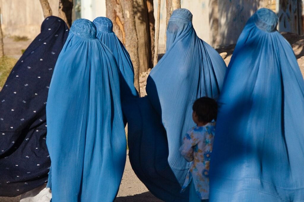 Women in burqa with their children in Herat, Afghanistan. Photo: Marius Arnesen/CC BY-SA 2.0

				
				
				
				
				A grim milestone this Saturday – five years since the fall of Kabul. That’s 1,826 days of Taliban rule. In that time the pillars sustaining a free and pluralistic society have crumbled. Press freedom has been dismantled and political opposition made obsolete.
Women and girls have borne the brunt of the Taliban’s repressive regime. Removed from public life – not even allowed to be seen at windows – they now have fewer rights than people in closed societies like North Korea. While enforcement of the Taliban’s seemingly endless edicts has been patchy, even under more moderate officials life is relentlessly tough, with women’s freedoms nothing on what they were before the Taliban’s return. “Gender apartheid” is the phrase most commonly used to describe this dreadful state of affairs. As part of our Letters from Afghan Women project, which was inspired by our Letters from Lukashenka’s Prisoners, we’ve called Afghanistan “a domestic prison”. It has also been referred to as a lockdown, only one with no end in sight. Five years ago, people in the UK were on the other side of the last and longest pandemic lockdown. Five years on, Afghan women are still trapped in one.
This June, a group of women protested the arrest of other women for alleged violations of dress-code rules. Taliban authorities responded with brute force, shooting at them and killing at least two. But the episode, rare as it was, at least revealed one positive – parts of Afghan society remain willing to challenge the authority of the Taliban.
The Taliban know there are chinks in their armour. This probably explains why officials and government employees were recently ordered to stop using smartphones. Videos making the rounds online showed Taliban members destroying their phones in compliance. Many fear that these restrictions may yet be extended to everyone, thus severing an essential lifeline.
So much has been lost but not everything: we must continue fighting to ensure that when the Taliban does eventually fall, some infrastructure for freedom of expression remains. That has been a motivator over the last five years when it has all felt bleak, and it fits into Index’s broader theory of change: one voice amplified helps many. Since 2021 we’ve arranged fundraisers for Afghan journalists, we’ve given an award to a brave educator with a mobile school, we’ve created the aforementioned letters project and we’ve published the words of Afghan women (and others) many times. We have provided an essential platform for them to speak, because in the words of Rahmati, a 24-year-old from Kabul: “I realised that I wanted to scream. Not just a sound, something deeper. I wanted to scream that I exist. That I am a human being. That I have thoughts and a heart and a voice.” Index became her place to scream. We offered her momentary respite from an otherwise grim reality.
We won’t stop, for Rahmati and the millions of others like her, human beings with thoughts, hearts and voices. If you want to help, read their words, share them, donate to us, become an Index member. Just please don’t look away.

			
			
					
				
				
				
				READ MORE
