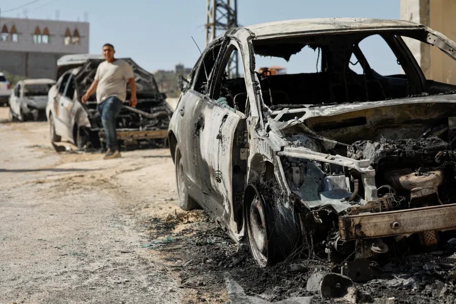 Destroyed cars, which Palestinians say were burned by Israeli settlers overnight, in Jalud, near Nablus, in the Israeli-occupied West Bank, August 4, 2026.