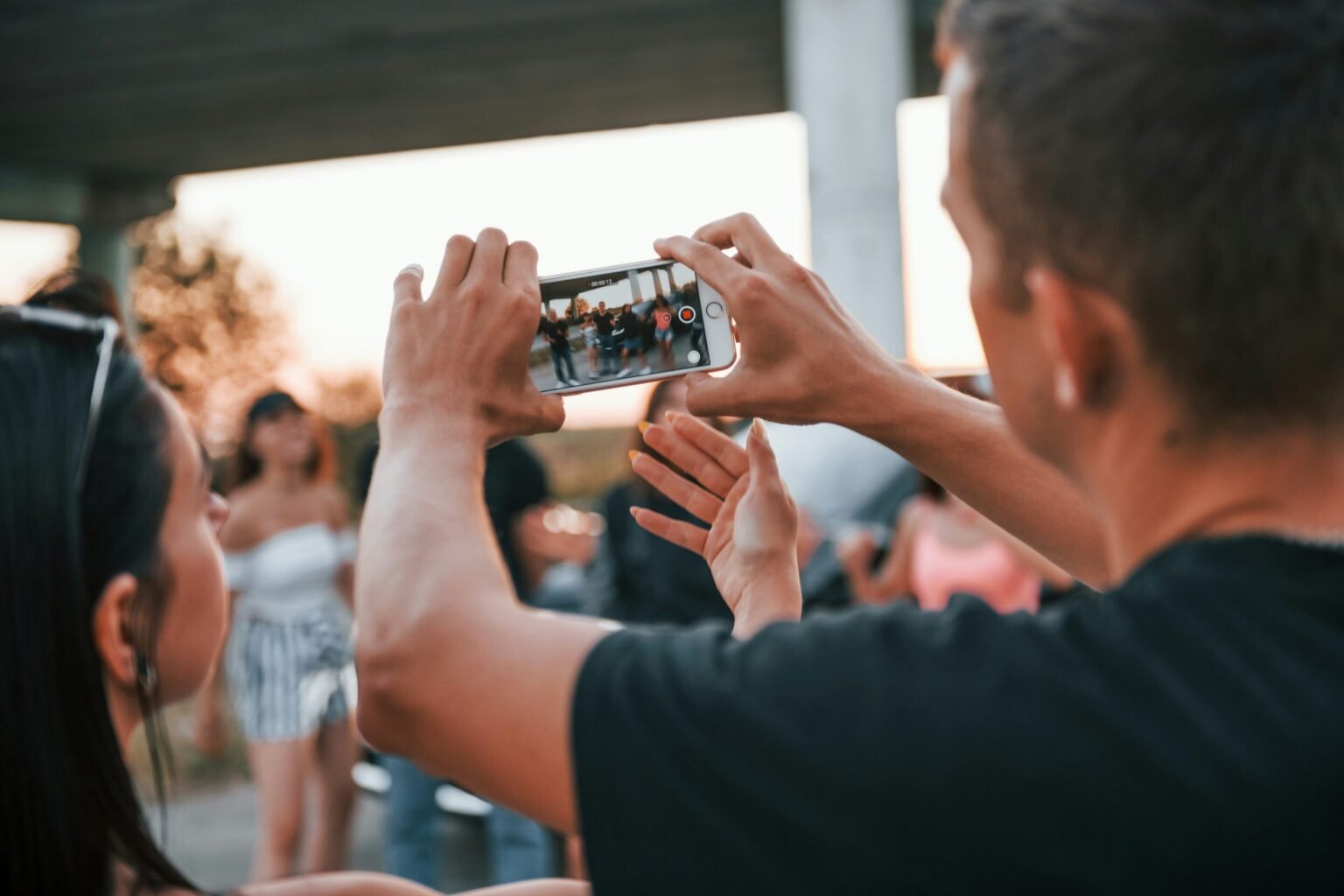 Guidance on public photography should be shared with everyone in the UK not just asylum seekers. Photo: Getty Images for Unsplash+

				
				
				
				
				Asylum seekers in the UK are being misled by the Home Office over laws about photographing people in public places and are being threatened that their asylum claims might be refused and could be kicked out of the country.
On 19 August, the Home Office issued a poster entitled “Do not photograph or film people in public” as part of a series of guidance over consequences of behaviour for those seeking asylum. The poster is part of a nine-page booklet that aims to help asylum seekers understand what is expected of them when living in the UK and covers issues such as sexual consent and domestic abuse.
The release of the booklet is controversial because the guidance it contains applies to everyone in the UK and not just asylum seekers. Its publication now could be seen as a politically motivated sop to those who want to crack down on all immigration, even though Britain is legally bound to admit genuine refugees.
In the introduction, the Home Office says, “We understand that coming to a new country can be difficult, and that laws and customs here may be different from your home country.”
The poster says, “In the UK, you should not take pictures or videos of someone without their permission. This includes taking pictures or videos in public spaces, like streets of parks, or in private spaces, like at home.”
However, the poster is misleading. There is a common misconception that photographing people in public places without their consent is illegal. It is not.
There are some situations where there are restrictions, for example where photography is restricted by law, such as outside military facilities where photography is prohibited because of national security concerns. Photography is also not permitted where an individual has a reasonable expectation of privacy, such as in the changing room of a clothes shop.
Many commercial, privately owned spaces also have rules regarding photography. Sheffield’s Meadowhall shopping centre, for example, says filming and photography is not permitted unless authorised.
Where there are no restrictions, consent is not required by law but many legitimate street photographers follow codes of conduct where they might seek consent. The Royal Society of Photographers, for example, recommends that “particular care should be taken when photographing children and vulnerable people, with consideration given to consent, safeguarding, privacy and the potential impact of making or sharing an image”.
It adds, “Photographers should also consider how images of identifiable people are subsequently used, especially where their use could imply endorsement or raise concerns about commercial exploitation.”
Repeated photography of a person without their consent could be illegal if it crosses into harassing behaviour that is likely to cause alarm or intimidation. This is banned by the Protection from Harassment Act 1997. Photographers must also not share pictures of a sexual nature, for example upskirting, without the subject’s permission. This is banned under the Criminal Justice and Courts Act 2015.
When asked about the poster, a Home Office spokesperson said: “We expect everyone who comes to the UK to abide by our laws. If they do not, they will face consequences, including the refusal of their asylum claim and removal from the UK.”
They added, “These resources were produced for asylum seekers so there can be no possible misunderstanding of what we expect. The poster is designed to communicate two separate messages:

Firstly, that individuals should not take photographs of others without their consent.
Secondly, that sharing photographs or videos of a sexual nature without someone’s permission is a serious criminal offence.”

There are subtle indications that the Home Office knew that what it was publishing was incorrect. Looking at the poster closely, it appears that the word “should” has been added later, suggesting that it previously said “must” – the font used is subtly different (see below).
The information contained in a new Home Office poster is incorrect
The Home Office did not respond to our request for comment when we asked about this. The spokeperson said of the poster, “It does not suggest that you can go to prison for taking someone’s photo in public.”
There are nuances of English grammar at play here. One person who commented on the BPPA’s statement on Instagram said, “It doesn’t say there’s a legal requirement not to? It says you shouldn’t which to be quite frank is good, if simplified, advice for asylum speakers for whom English is not a first language.”
However the heading of the poster is unequivocal. It says, “Do not”. Anyone, even those using English as a second language, would be unlikely to misconstrue that.
The original wording still appears to be on the Home Office website. In the booklet’s introduction it says: “In the UK, we respect people’s privacy. This means you must not take photographs or videos of someone without their consent.” (emphasis mine).
Photographers and photojournalists and their unions have been quick to call on the Home Office to clarify the poster.
The British Press Photographers’ Association (BPPA) has commented on the document. It said, “Recently issued Home Office guidance that states permission is needed to photograph people in public is incorrect and harmful. There is no legal requirement to seek permission when photographing in public. The BPPA hopes an immediate correction will be issued.”
Séamus Dooley, NUJ assistant general secretary, said: “This communication not only runs the risk of misleading asylum seekers, it could also have serious consequences for our members – particularly photographers and videographers who regularly carry out their work in public places. It also spreads public confusion that could serve to inhibit public interest journalism. Press photographers and other lens-based journalists perform a legitimate and important function in reporting and recording events in public spaces.
“The union is very concerned that the spread of inaccurate information around the right to photograph and film people in public without permission could expose our members to increased hostility and harassment as well as wrongful accusations of criminality and unjustifiable stops by the police. This would undermine journalists’ right to report and the public’s right to know.

			
			
					
				
				
				
				READ MORE