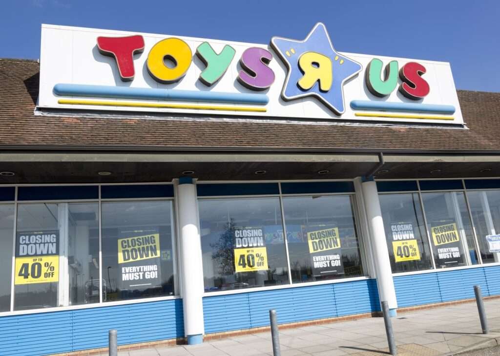 Toys R Us storefront with 'closing down' signs in the window